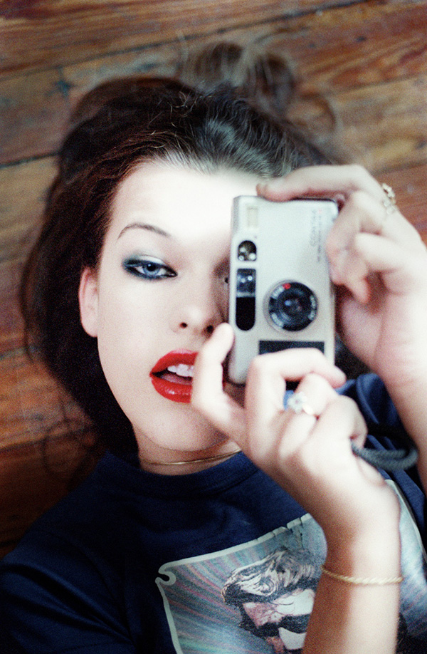 Milla Jovovich with a camera